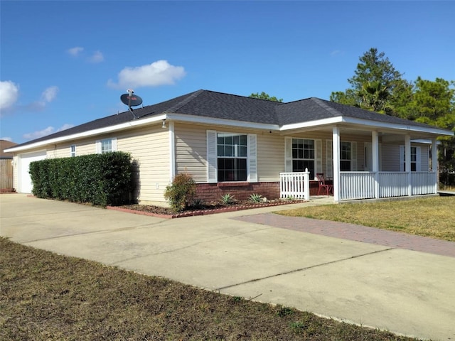 20 Hemlock Trl, Ocala, FL 34472 - view of front of home with a porch, a front yard, brick siding, a garage, and concrete driveway