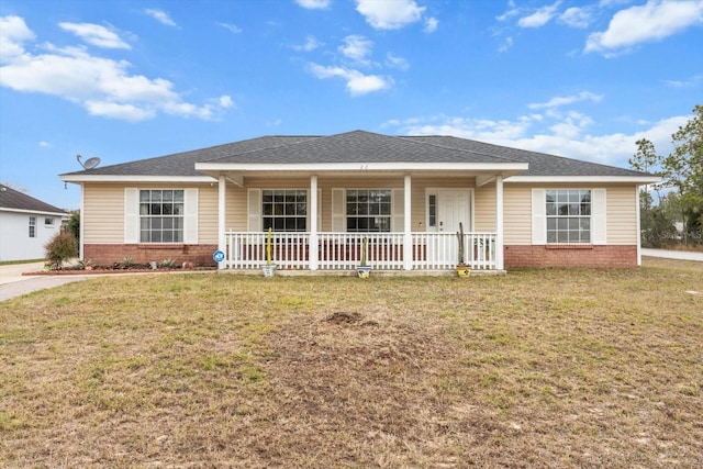 20 Hemlock Trl, Ocala, FL 34472 - view of front of home featuring a front yard, covered porch, and brick siding