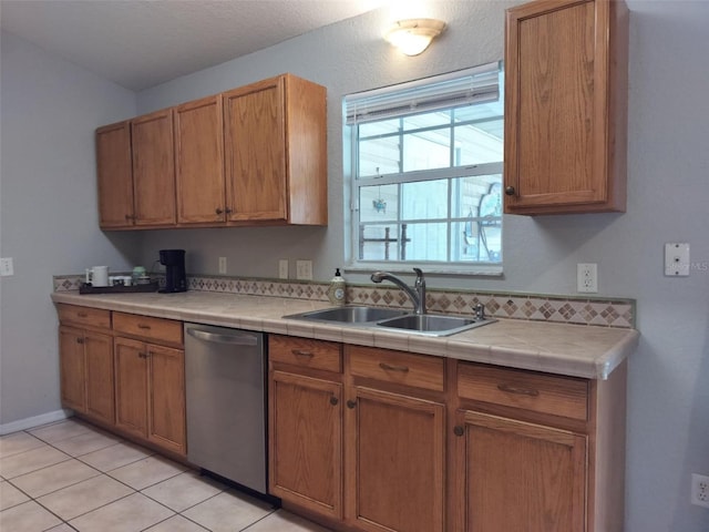 20 Hemlock Trl, Ocala, FL 34472 - kitchen with a sink, light tile patterned floors, tile countertops, and dishwasher