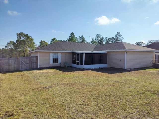 20 Hemlock Trl, Ocala, FL 34472 - rear view of property with central AC unit, a shingled roof, fence, a yard, and a sunroom