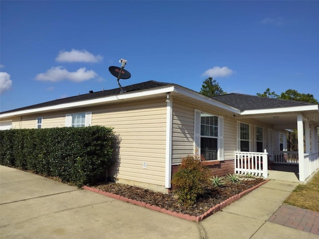 20 Hemlock Trl, Ocala, FL 34472 - view of property exterior featuring covered porch