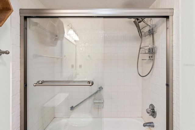full bath with combined bath / shower with glass door