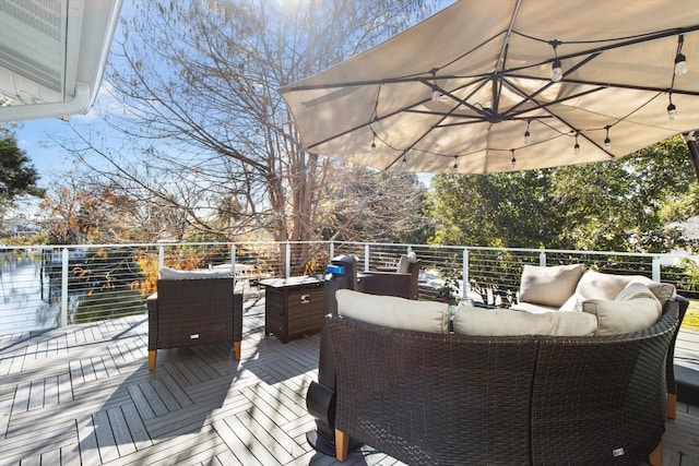 wooden deck featuring an outdoor hangout area