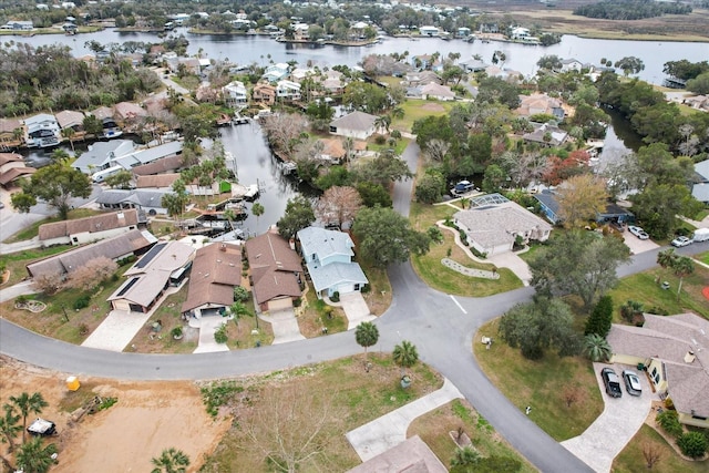 aerial overview of property's location with nearby suburban area and a nearby body of water