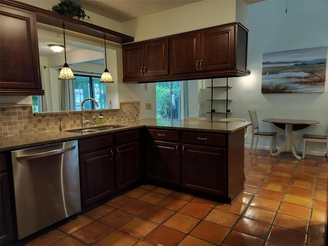 kitchen with dishwasher, a sink, tasteful backsplash, and plenty of natural light