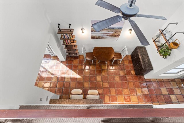 living area with a ceiling fan