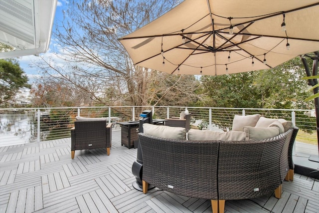 wooden terrace with outdoor lounge area