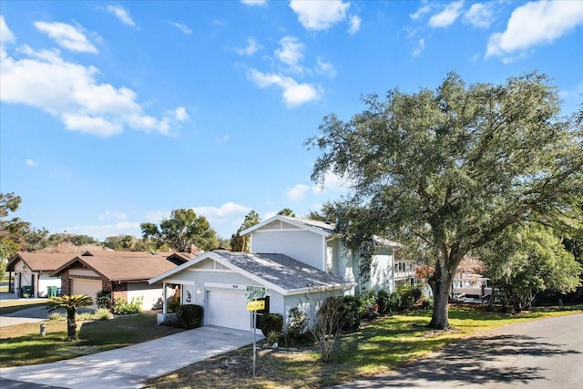 view of front of home with a garage, a residential view, driveway, a front lawn, and stucco siding