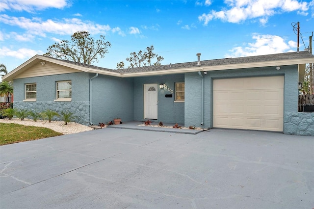 ranch-style home with a garage