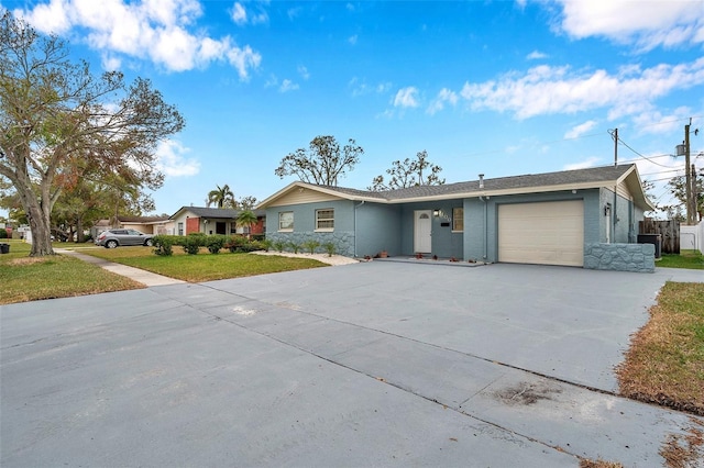 ranch-style house with a garage and a front yard