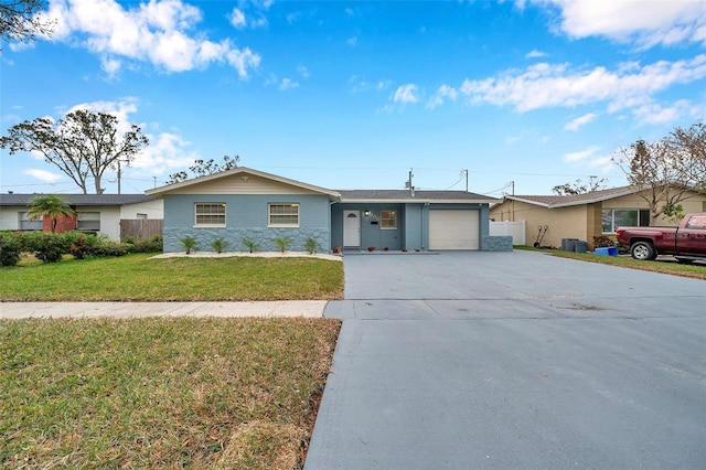 ranch-style home with a garage and a front yard