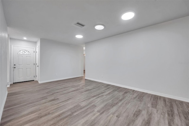 unfurnished room featuring light wood-type flooring