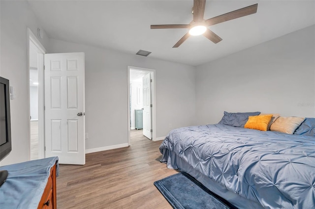 bedroom with hardwood / wood-style flooring and ceiling fan