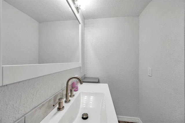 bathroom featuring vanity and a textured ceiling