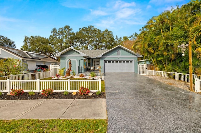 ranch-style home featuring a garage