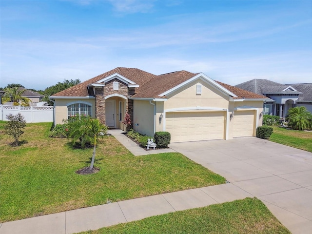 view of front of house with a garage and a front lawn