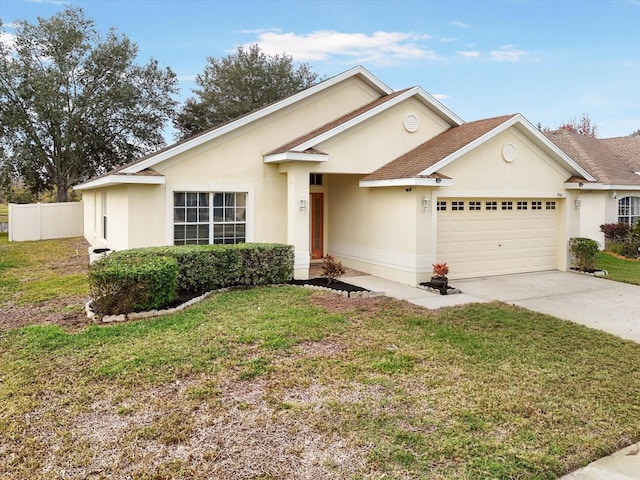 view of front facade featuring a garage and a front lawn