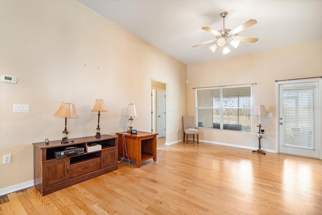 foyer with ceiling fan and light hardwood / wood-style flooring