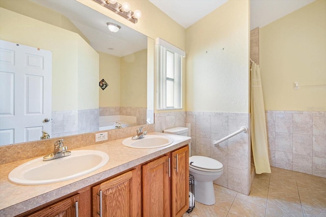 bathroom with toilet, tile walls, tile patterned floors, a bath, and vanity