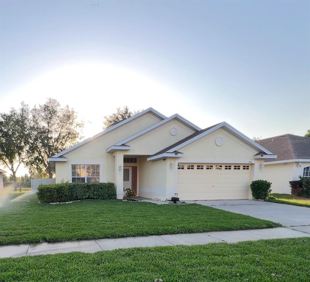 9551 Jaybird Ln, Land O Lakes, FL 34638 - ranch-style house with an attached garage, concrete driveway, a front lawn, and stucco siding