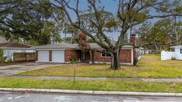 view of front of house featuring a garage and a front yard