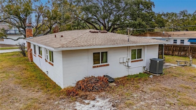 view of side of property with central AC