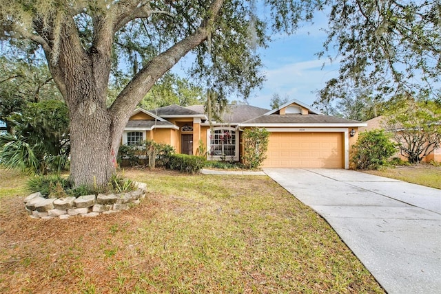 ranch-style home featuring a garage and a front lawn