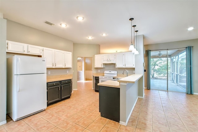 kitchen featuring white appliances, light tile patterned floors, white cabinets, decorative light fixtures, and sink