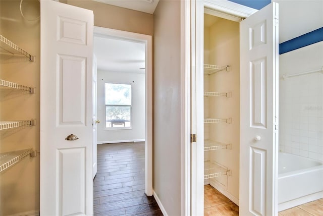 corridor featuring light hardwood / wood-style floors