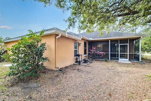 back of property featuring a sunroom