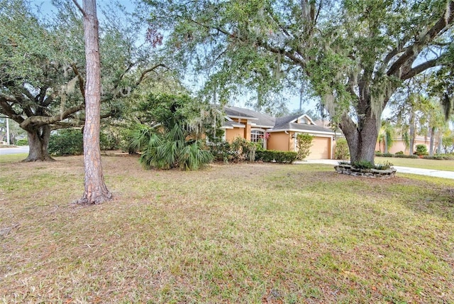 view of yard featuring a garage