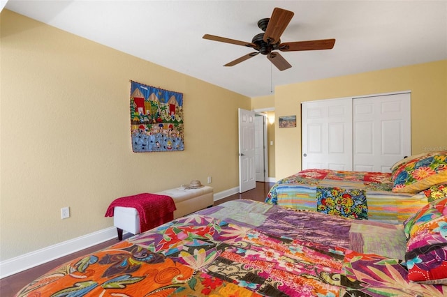 bedroom with wood-type flooring, ceiling fan, and a closet