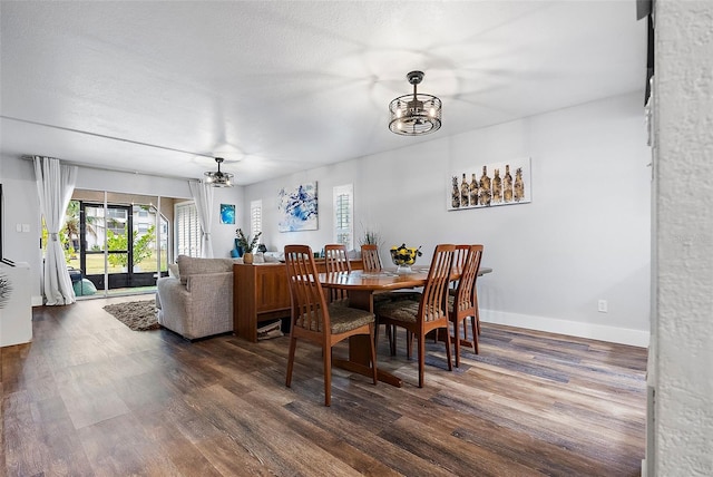 dining room with dark hardwood / wood-style flooring