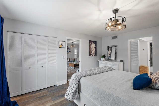 bedroom with a closet and dark hardwood / wood-style floors