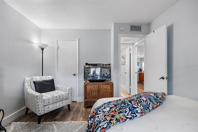 bedroom featuring wood-type flooring