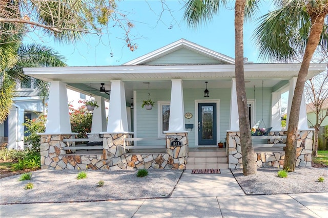 view of front of home featuring ceiling fan and covered porch