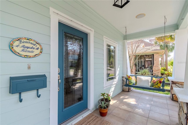 doorway to property with a porch