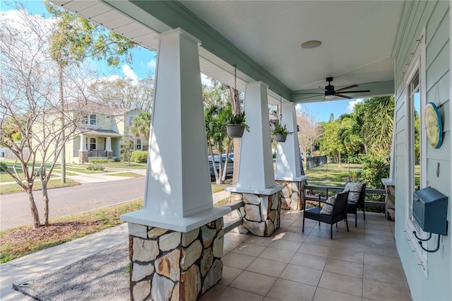 view of patio featuring ceiling fan and covered porch