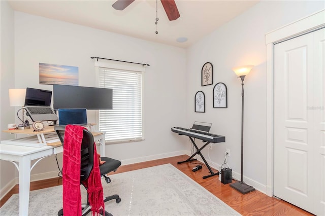 office space with hardwood / wood-style floors and ceiling fan