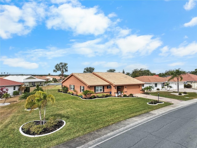 single story home featuring a garage and a front yard