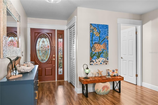 entryway with dark wood-type flooring