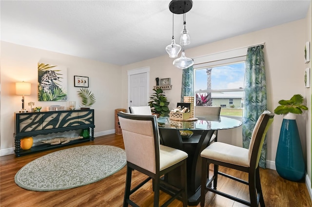 dining room with dark wood-type flooring