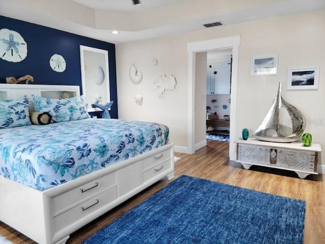 bedroom featuring dark hardwood / wood-style flooring