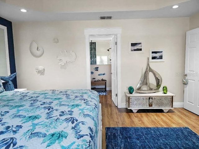 bedroom featuring wood-type flooring