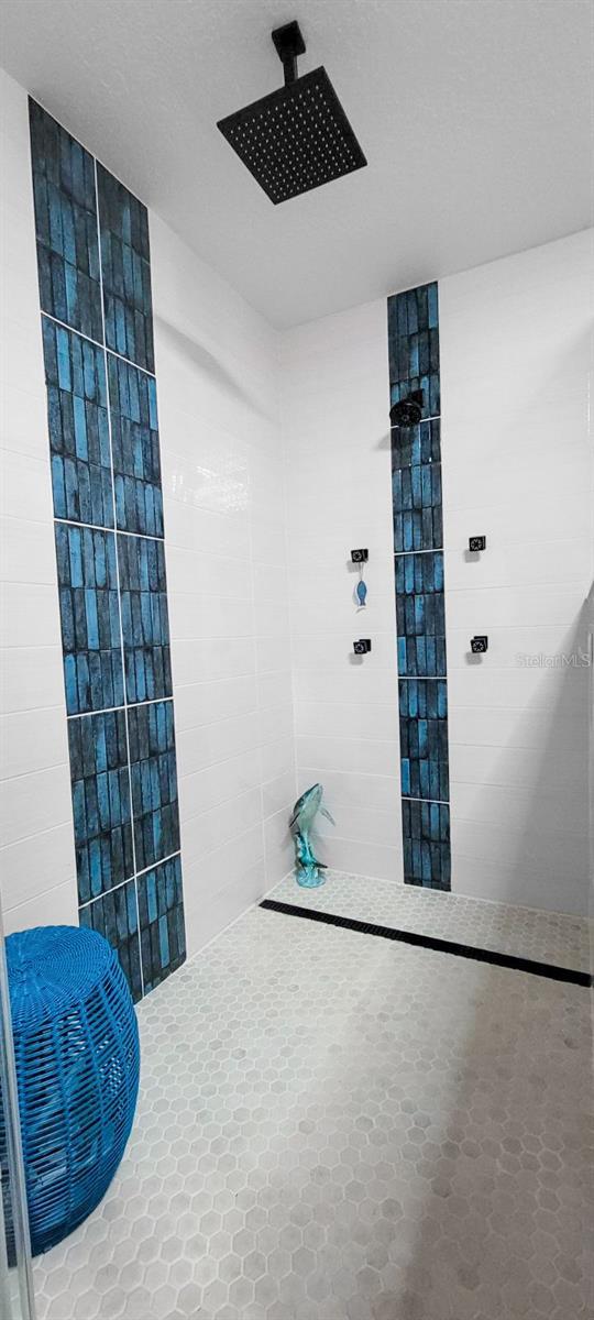 bathroom featuring a shower