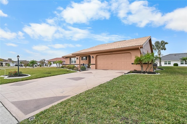 ranch-style home featuring a garage and a front yard