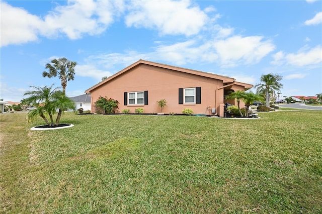 view of property exterior featuring a lawn