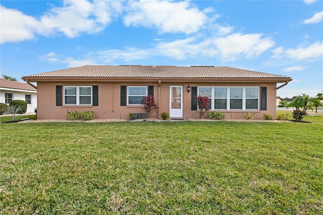 ranch-style house featuring a front lawn