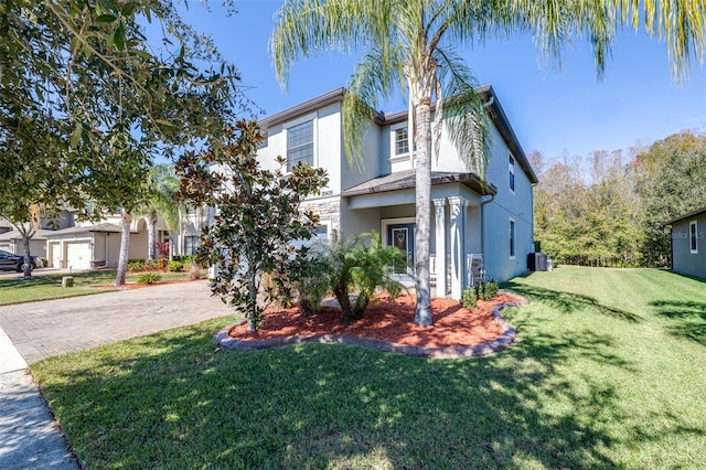 view of front of home featuring a garage and a front yard