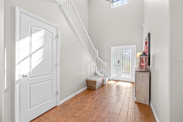 entrance foyer featuring a towering ceiling